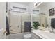 Bright bathroom with shower over tub and white vanity at 10240 Notte Ave, Las Vegas, NV 89135