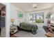 Cozy bedroom with a large window, soft rug, and natural light at 10240 Notte Ave, Las Vegas, NV 89135