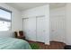 Bright bedroom featuring a large window, ample closet space, and neutral decor at 10240 Notte Ave, Las Vegas, NV 89135