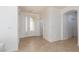Bright foyer with a decorative glass front door and neutral tile flooring at 10240 Notte Ave, Las Vegas, NV 89135
