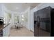 Eat-in kitchen featuring a bay window, breakfast nook, and stainless-steel appliances with tile flooring at 10240 Notte Ave, Las Vegas, NV 89135