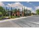 Scenic street view of the community with lush landscaping and well-maintained sidewalks at 10240 Notte Ave, Las Vegas, NV 89135