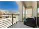 Balcony with black wicker furniture and view of neighborhood at 10429 Rose Palisade St, Las Vegas, NV 89141