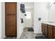 Bright bathroom features a double sink vanity, walk-in shower, and neutral-toned tile floors at 10429 Rose Palisade St, Las Vegas, NV 89141