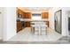 Well-lit kitchen features stainless steel appliances, a granite countertop, and a convenient island with stool seating at 10429 Rose Palisade St, Las Vegas, NV 89141
