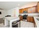 Updated kitchen with granite countertops, stainless appliances, a large island and bar seating at 10429 Rose Palisade St, Las Vegas, NV 89141