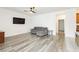 Bright living room with sleek, modern flooring and neutral wall color at 10429 Rose Palisade St, Las Vegas, NV 89141