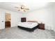 Spacious main bedroom features neutral color palette and a ceiling fan at 10429 Rose Palisade St, Las Vegas, NV 89141