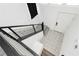 Minimalist staircase with carpeted steps, horizontal bar railing, and bright white walls and trim at 10429 Rose Palisade St, Las Vegas, NV 89141