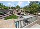 Inviting backyard featuring a tiki bar, outdoor seating, a fire pit, and meticulously landscaped terraces at 10645 Redwood Grove Ave, Las Vegas, NV 89144
