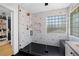 Stunning bathroom featuring a spacious shower with elegant geometric tile work and glass enclosure at 10645 Redwood Grove Ave, Las Vegas, NV 89144