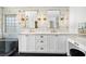 Elegant bathroom with dual sinks, marble countertops, and stylish lighting fixtures at 10645 Redwood Grove Ave, Las Vegas, NV 89144