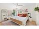 Serene bedroom with a light-colored bed, neutral decor, and warm wood accents for a cozy atmosphere at 10645 Redwood Grove Ave, Las Vegas, NV 89144