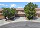 Charming home boasts a well-maintained exterior with a spacious three-car garage and lush landscaping at 10645 Redwood Grove Ave, Las Vegas, NV 89144