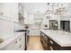 Modern kitchen featuring white cabinets, quartz countertops, and stainless steel appliances at 10645 Redwood Grove Ave, Las Vegas, NV 89144
