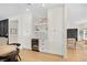 Living space with built-in wine fridge, white cabinets, and stylish design at 10645 Redwood Grove Ave, Las Vegas, NV 89144