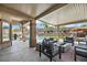 Spacious covered patio with outdoor furniture, perfect for lounging and entertaining with views of the pool and backyard at 10645 Redwood Grove Ave, Las Vegas, NV 89144