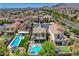 Desirable community featuring a home with a private pool, hot tub, solar panels, and lush landscaping at 10656 Hyde Corner Ave, Las Vegas, NV 89166