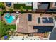 Aerial rooftop view featuring a pool, jacuzzi, landscaping, and solar panels on a modern home at 10656 Hyde Corner Ave, Las Vegas, NV 89166