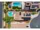 Aerial view of a home showing a private backyard pool, spa, and solar panels on the roof at 10656 Hyde Corner Ave, Las Vegas, NV 89166