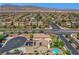 Wide aerial view of homes, streets and desert landscape, mountain views in the distance at 10656 Hyde Corner Ave, Las Vegas, NV 89166