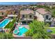 Inviting backyard with a pool, spa, and a covered patio providing ample space for relaxation and outdoor dining at 10656 Hyde Corner Ave, Las Vegas, NV 89166