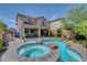 Inviting backyard featuring a custom pool, spa, patio area, perfect for relaxation and outdoor entertaining at 10656 Hyde Corner Ave, Las Vegas, NV 89166