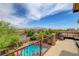 Resort-style backyard with pool, spa, seating area, and mountain views for ultimate relaxation and entertainment at 10656 Hyde Corner Ave, Las Vegas, NV 89166