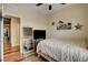 Bright bedroom featuring stylish decor, a large mirror, and wood-look floors at 10656 Hyde Corner Ave, Las Vegas, NV 89166