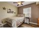 Bedroom featuring wood floors, horse art and neutral paint at 10656 Hyde Corner Ave, Las Vegas, NV 89166
