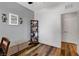 Charming bedroom featuring stylish wood floors, and bench with storage at 10656 Hyde Corner Ave, Las Vegas, NV 89166