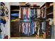 Walk-in closet featuring custom shelves, cabinets, hanging rods and lots of storage at 10656 Hyde Corner Ave, Las Vegas, NV 89166
