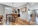 Inviting dining area featuring wood floors, rustic decor, and an elegant chandelier at 10656 Hyde Corner Ave, Las Vegas, NV 89166