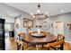 Cozy dining area with a round table, rustic chandelier, and stylish decor at 10656 Hyde Corner Ave, Las Vegas, NV 89166