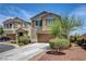 Charming two-story home with a well-manicured lawn, mature landscaping, and a convenient two-car garage at 10656 Hyde Corner Ave, Las Vegas, NV 89166