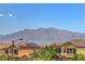 Charming residential view showcasing houses with solar panels and views of a scenic mountain range in the distance at 10656 Hyde Corner Ave, Las Vegas, NV 89166