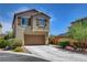 Charming two-story home with a well-maintained front yard and two car garage at 10656 Hyde Corner Ave, Las Vegas, NV 89166