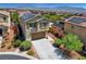 Charming two-story home with desert landscaping, solar panels, and a two-car garage at 10656 Hyde Corner Ave, Las Vegas, NV 89166