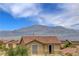 Scenic mountain views enhance this home with a balcony, offering a picturesque backdrop for relaxation and enjoyment at 10656 Hyde Corner Ave, Las Vegas, NV 89166