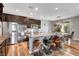 Well-equipped kitchen with stainless steel appliances and lots of dark wood cabinets at 10656 Hyde Corner Ave, Las Vegas, NV 89166