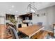 Modern kitchen and dining area featuring dark cabinetry and a butcher block dining table at 10656 Hyde Corner Ave, Las Vegas, NV 89166