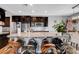 Stylish kitchen showcasing dark cabinets, stainless steel appliances, and a large center island at 10656 Hyde Corner Ave, Las Vegas, NV 89166