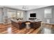 Bright living room showcases wood floors, plenty of natural light, and cozy, upscale furniture at 10656 Hyde Corner Ave, Las Vegas, NV 89166