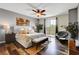 Serene main bedroom with wood floors, ceiling fan, and a sliding glass door at 10656 Hyde Corner Ave, Las Vegas, NV 89166