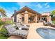An inviting outdoor area features a luxurious patio, pool access, and plenty of lounge seating at 11 Knob Oak Dr, Henderson, NV 89052