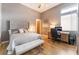Comfortable bedroom featuring a bed, desk area, ceiling fan, and a window for plenty of natural light at 11 Knob Oak Dr, Henderson, NV 89052