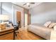 Comfortable bedroom featuring a bed, desk area, ceiling fan, and a window for plenty of natural light at 11 Knob Oak Dr, Henderson, NV 89052
