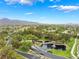 Picturesque aerial view of a beautifully landscaped community featuring a tranquil pond and a golf course at 11 Knob Oak Dr, Henderson, NV 89052