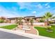 Inviting single-story home with manicured lawn and palm trees at 11 Knob Oak Dr, Henderson, NV 89052