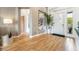 Inviting foyer with wood floors, art, and access to other rooms at 11 Knob Oak Dr, Henderson, NV 89052